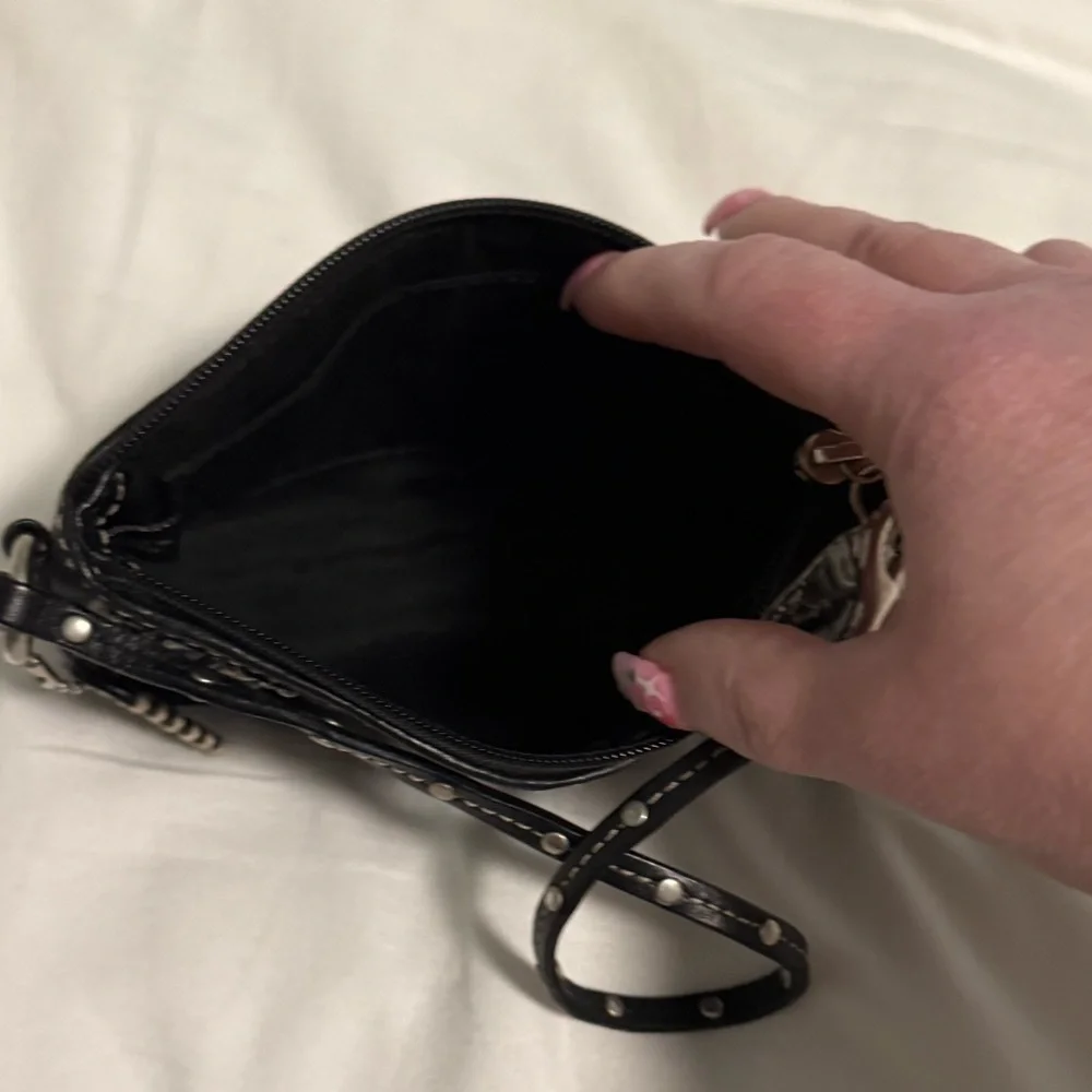 Coach Rare NWOT Studded and Embroidered Black and Cream Patterned Wristlet!